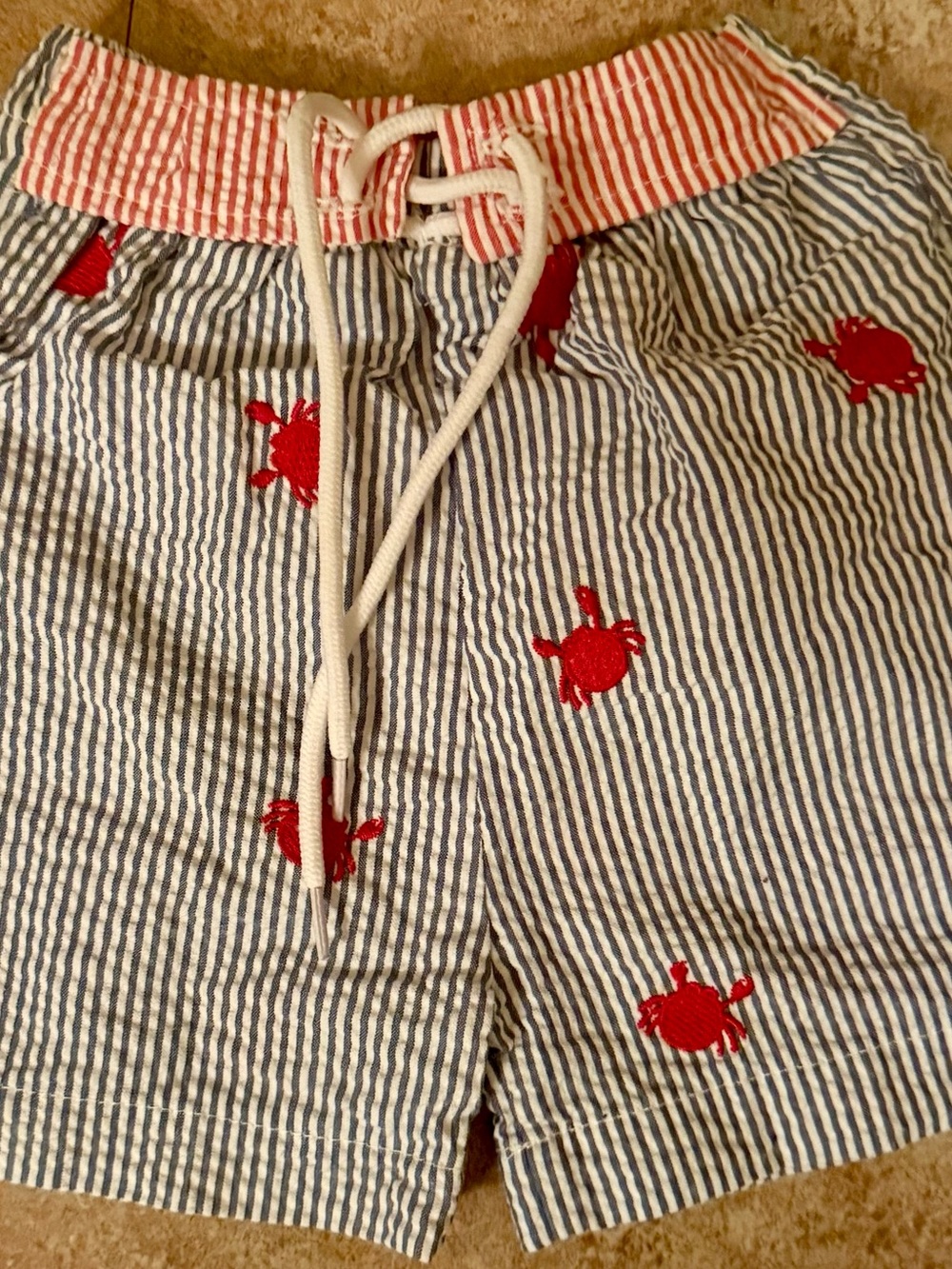 Mud Pie Blue and White Seersucker Baby Swim Trunks with Red Crabs Embroidered